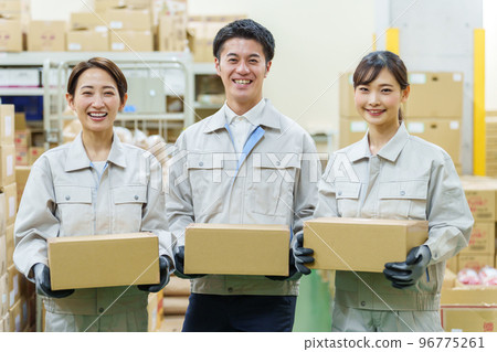 Portrait of worker carrying cardboard Portrait of worker carrying cardboard 96775261