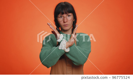 Woman say no hold palm folded crossed hands in stop gesture, warning of finish, prohibited access 96775524