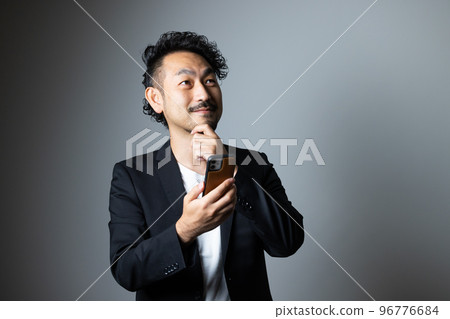 bearded man with smartphone 96776684