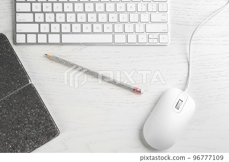 Flat lay composition with mouse and keyboard on white wooden table 96777109