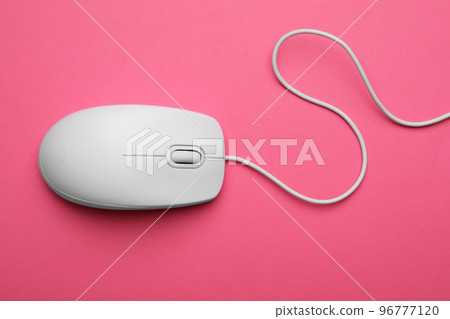 Wired computer mouse on pink background, top view Wired computer mouse on pink background, top view 96777120