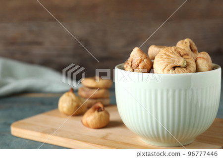 Tasty dried figs on blue wooden table, closeup. Space for text Tasty dried figs on blue wooden table, closeup. Space for text 96777446