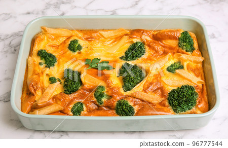 Tasty broccoli casserole in baking dish on white marble table, closeup Tasty broccoli casserole in baking dish on white marble table, closeup 96777544