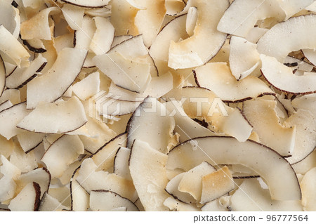 Delicious fresh coconut chips as background, closeup 96777564