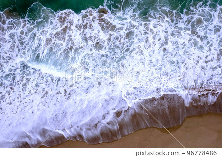 Aerial view of the beach where rough waves rush Aerial view of the beach where rough waves rush 96778486