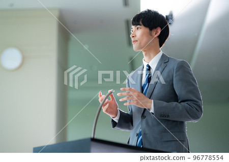 A man in his 30s taking the stage 96778554