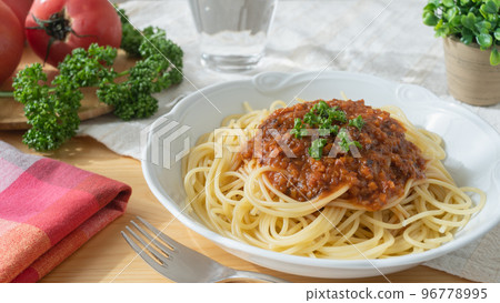 Spaghetti with meat sauce | Tomato and parsley ingredients Spaghetti with meat sauce | Tomato and parsley ingredients 96778995