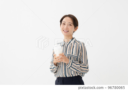 Woman drinking milk protein health Woman drinking milk protein health 96780065