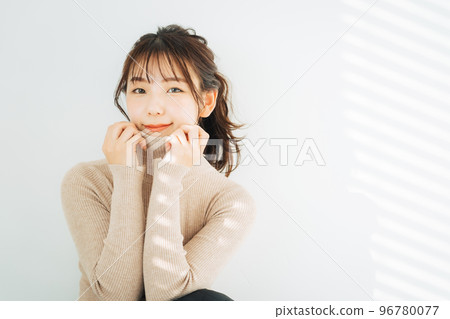 woman wearing turtleneck knit 96780077