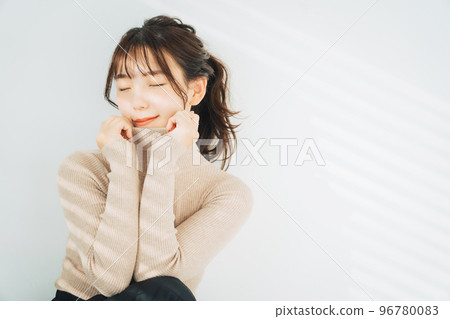woman wearing turtleneck knit woman wearing turtleneck knit 96780083