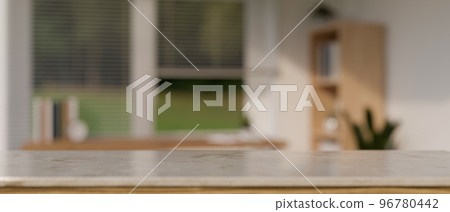 Copy space on marble tabletop over blurred minimal living room in the background. 96780442