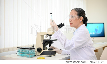Successful Asian senior female scientist supervisor working in the laboratory 96781175