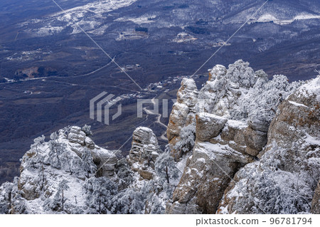 Rocks on Southern Demerdzhi mountain in snow after blizzard in spring. Crimea 96781794