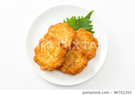Deep-fried satsuma on a plate with a white background Deep-fried satsuma on a plate with a white background 96782205