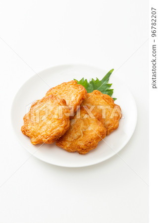 Deep-fried satsuma on a plate with a white background Deep-fried satsuma on a plate with a white background 96782207
