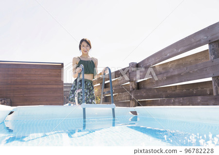 Sauna girl taking a water bath after sauna 96782228