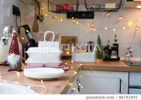 Food delivery service containers on table white scandi festive kitchen in christmas decor. Eve New year, saving time, too lazy to cook, hot order, disposable plastic box in fairy light. mock up Food delivery service containers on table white scandi festive kitchen in christmas decor. Eve New year, saving time, too lazy to cook, hot order, disposable plastic box in fairy light. mock up 96782891