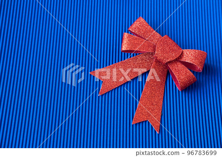 big red bow on a blue background, top viewcopy space big red bow on a blue background, top viewcopy space 96783699