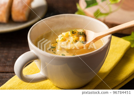 Warm corn potage soup with a gentle steam 96784451