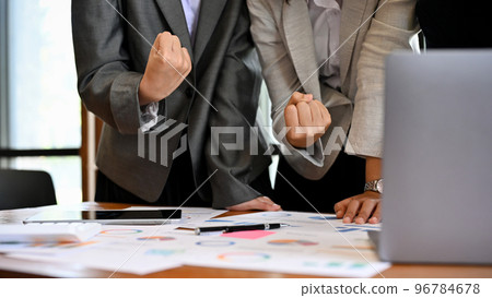 Businesspeople team in the meeting, celebrating business successful, winning, goal achievement. 96784678