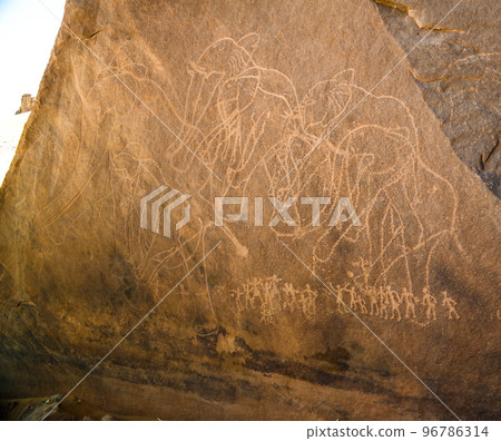 elephant and men- Cave paintings and petroglyphs at Boumediene ,Tassili nAjjer national park, Algeria 96786314