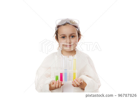 Caucasian smart child girl learning science chemistry, holding test tubes making experiment at school laboratory. Education Science Chemistry and children concept . Early development of children. 96787826