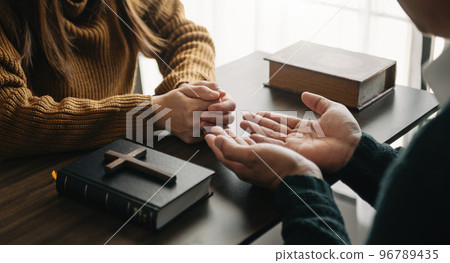 Christians are congregants join hands to pray and seek the blessings of God... 96789435