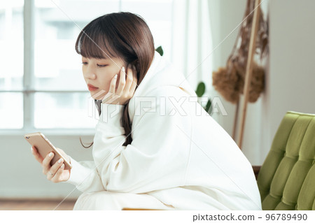 A young woman who feels tired of SNS 96789490