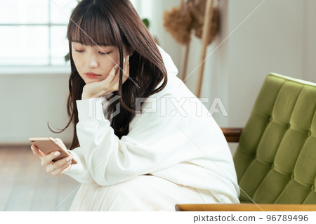 A young woman who feels tired of SNS A young woman who feels tired of SNS 96789496