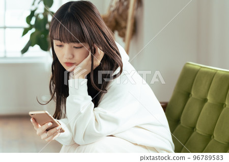 A young woman who feels tired of SNS 96789583