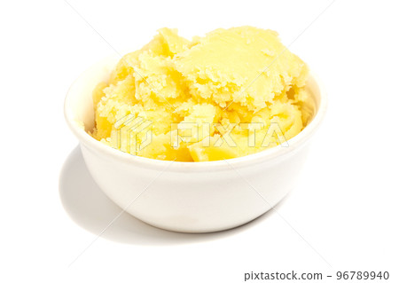 Ghee in bowl isolated on white background Ghee in bowl isolated on white background 96789940