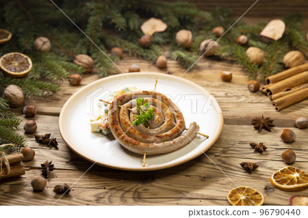 Christmas wine sausage served with potato salad 96790440
