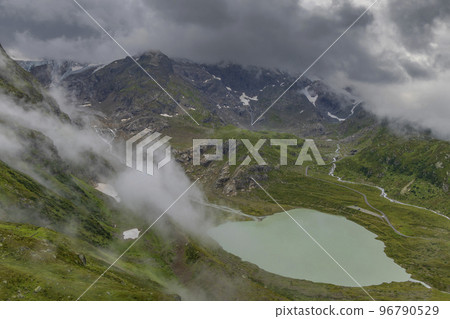 Typical alpine landscape of Swiss Alps with Steinsee, Urner Alps, Canton of Bern, Switzerland Typical alpine landscape of Swiss Alps with Steinsee, Urner Alps, Canton of Bern, Switzerland 96790529