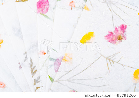 The Stack of different handmade paper with dry leaf and flower. The Stack of different handmade paper with dry leaf and flower. 96791260