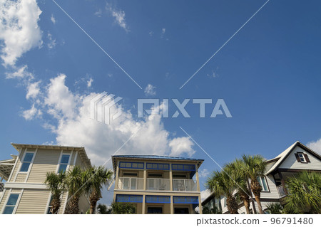 Facade of three houses with painted wood sidings at Destin, Florida 96791480