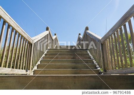 Wooden staircase against the clear sky at the beach in Destin, Florida 96791486