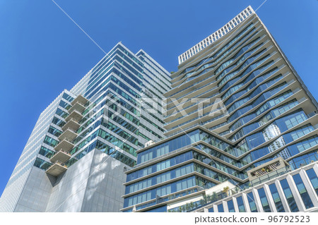 Austin, Texas- Low angle view of a modern high-rise buildings under the blue sky Austin, Texas- Low angle view of a modern high-rise buildings under the blue sky 96792523