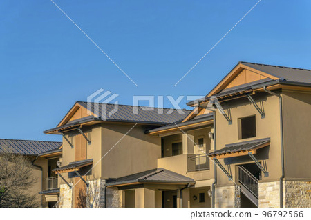 Austin, Texas- Brown schemed apartment building with window canopies Austin, Texas- Brown schemed apartment building with window canopies 96792566