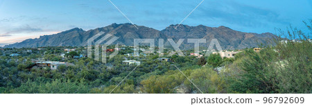 Panorama of a mountainside neighborhood with green plants and trees outdoors at Tucson, Arizona 96792609