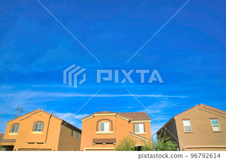 Suburbs houses facade with rustic exterior at Tucson, Arizona 96792614