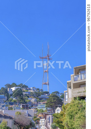 Peak of Sutro Tower above the hill with houses on the slope at San Francisco, California Peak of Sutro Tower above the hill with houses on the slope at San Francisco, California 96792618