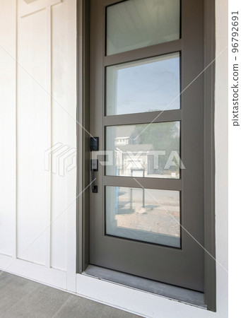 Vertical Exterior of a house with white board and batten sidings Vertical Exterior of a house with white board and batten sidings 96792691