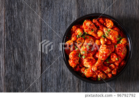 chicken stew with mushrooms in a tomato sauce 96792792