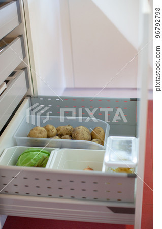 Storing vegetables in the kitchen. Storing vegetables in the kitchen. 96792798