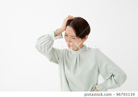Woman holding her head white background Woman holding her head white background 96793139