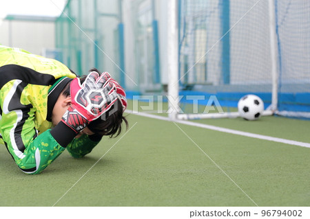 A goalkeeper man who is sad about losing a goal A goalkeeper man who is sad about losing a goal 96794002