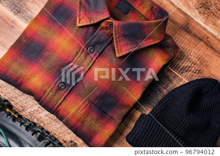 Flannel shirt on wooden table 96794012