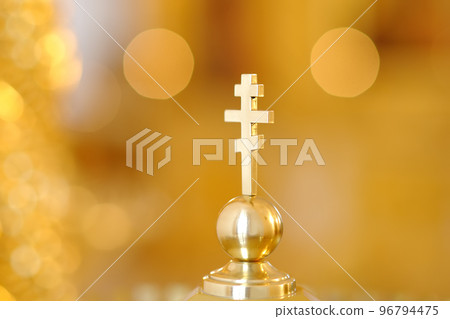 Gold Greek Orthodox cross close-up 96794475