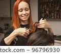 Womens fashion and style. Hair care, beauty industry concept. Hairdresser doing haircut closeup of 96796930