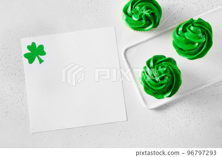 Patrick's Day cupcake with green whipped cream and blank with shamrock . 96797293